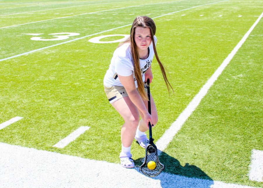 Junior Cat Connolly poses on the field.