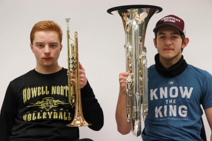 Seniors Robert Fairless and Anthony Davidson pose with their instruments.
