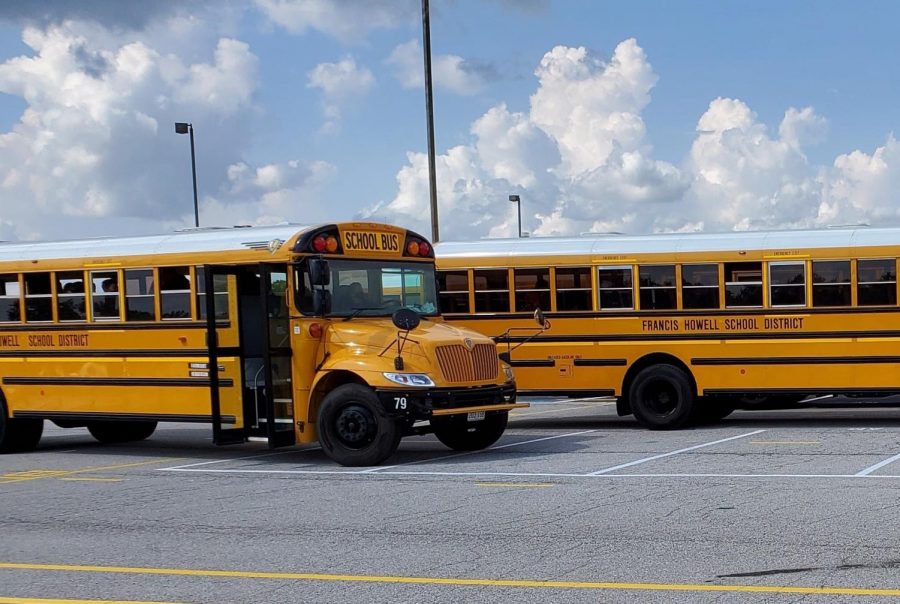The buses are parked in the Francis Howell North parking lot.