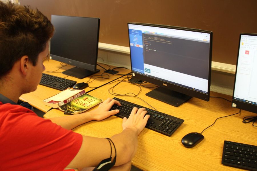 Macedonian foreign exchange student Borjan Georgievski works on his coding skills in Ms Eatons class. He is a senior here at North and is excited for his year long stay in America.