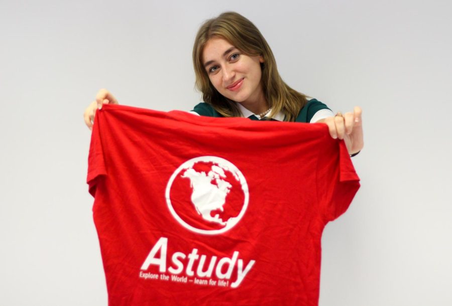 Senior Andreea Vacarus holds out a t-shirt that reads, “Astudy.” Astudy is the agency Vacarus went through in order to study abroad this year here at Francis Howell North. 