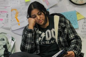 Surrounded by books and papers, sophomore Reem Mountassir studies for an upcoming final on Dec. 6. With finals being gone for the past two years, students are feeling anxious about winter finals. “I feel like since last year we didn’t do any, it’s a lot more stressful,” Mountassir said.
