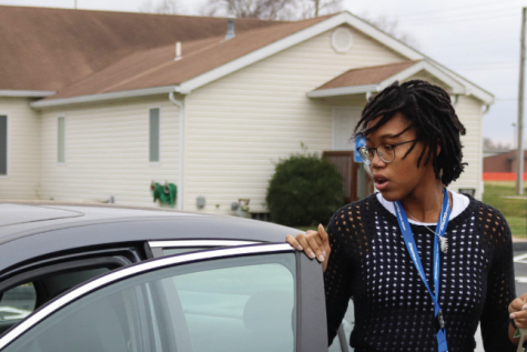 Senior Nila Milo gets out of her car to walk from the church to school. Due to the limited parking in FHN’s parking lot with ongoing construction, students were given permission to park there.