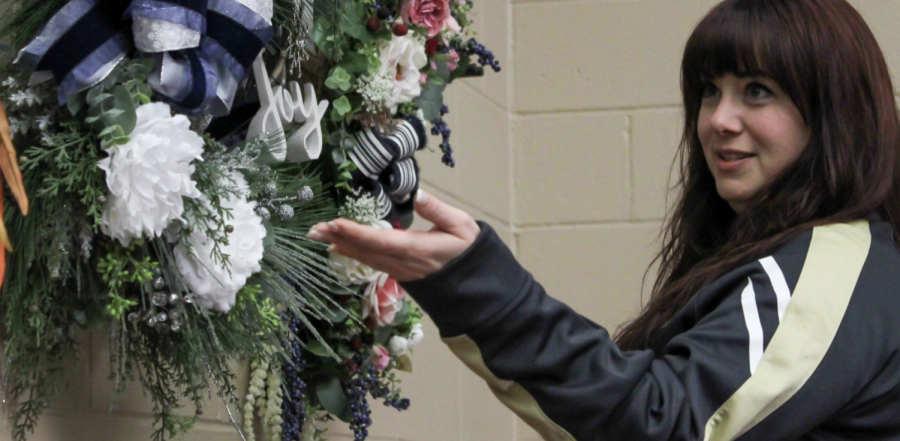 Gesturing towards her wreaths, choir director Jennifer Oncken explains the process of creating
them. Oncken works to customize her wreaths to fit her customers’ wants and aesthetics, but still
includes her own personal preference of working with only natural-looking materials.