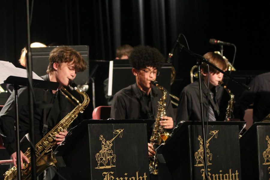 The saxophone section of FHN’s jazz II ensemble perform in unison.