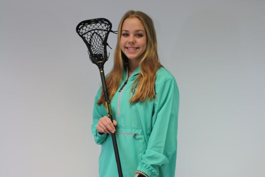 Smiling, Sophomore Kendra Swope holds her lacrosse stick. Swope has been playing lacrosse for a total seven years, and she’s been on FHN’s team for one year. Her first year playing in high school, Swope was ranked 4th in STLToday’s stat leaderboard, and she ended the season with 78 goals and 19 assists. “I simply love the sport,” Swope said. “No matter when I am playing it, I am always having so much fun and it has taught me so much.”