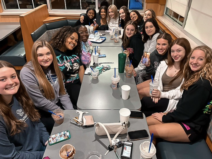 The FHN Varsity cheerleaders for the 2022-23 school year sit together for group bonding