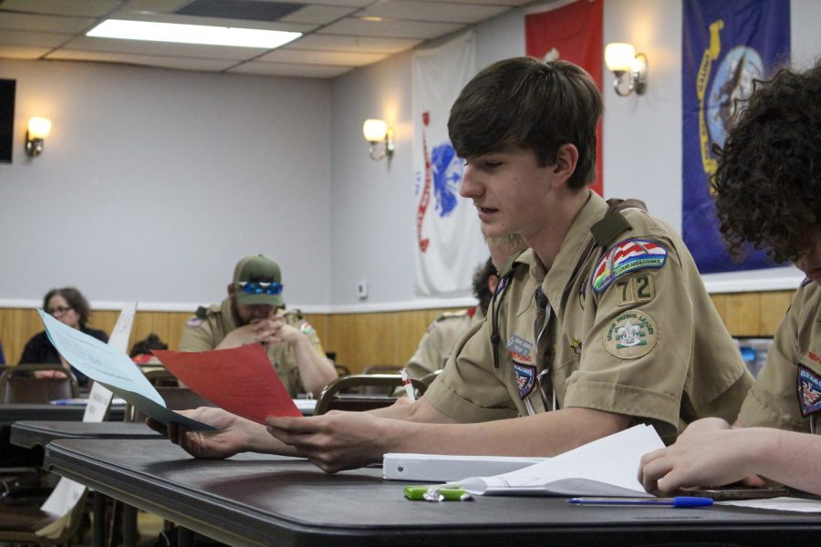 On April 25, Senior Patrol Officer Drake Morris informs his troop about upcoming events at VFW Hall 2866.
