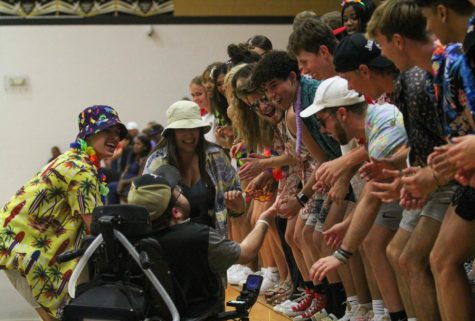Sarah Korte and other seniors cheer at the Fort Zumwalt South girls volleyball game on August 30. 