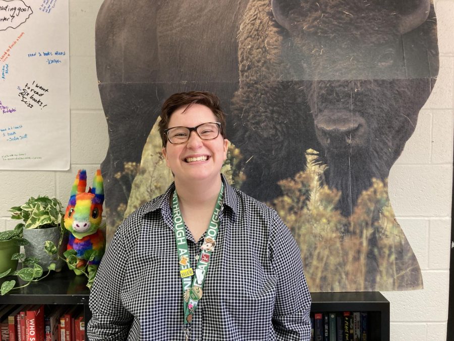 English teacher Ashley Seiss stands in front of a cutout of her favorite animal, the bison.