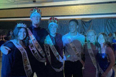 Homecoming Queen Sarah Korte, Homecoming Kings Ryan Murdock and Ian Pierce, and homecoming court members Ian Kelly, Riley Puhr, and Sarah Moutray pose for a photo at homecoming on Oct. 1.