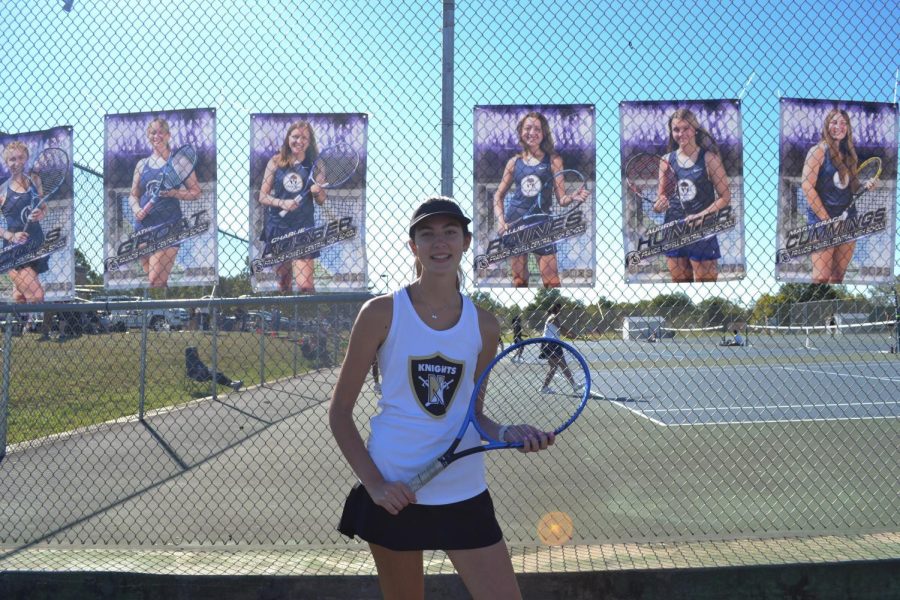 On Sept. 30 captain of the varsity tennis team 
Maggie Koester poses for a picture holding her tennis racket. The team has won a total of five games and lost a total of nine games. They had their final game at FHC on Sep. 30 winning 6-2 and 6-1.