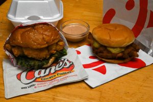 Cane’s chicken sandwich and Chick-fil-A chicken sandwich side by side.
