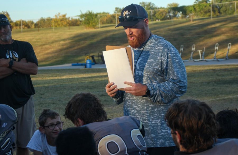  Brett Bevil is a teacher and coach at FHN, after practice Bevil talks to the players about their performance, upcoming events, or important information.