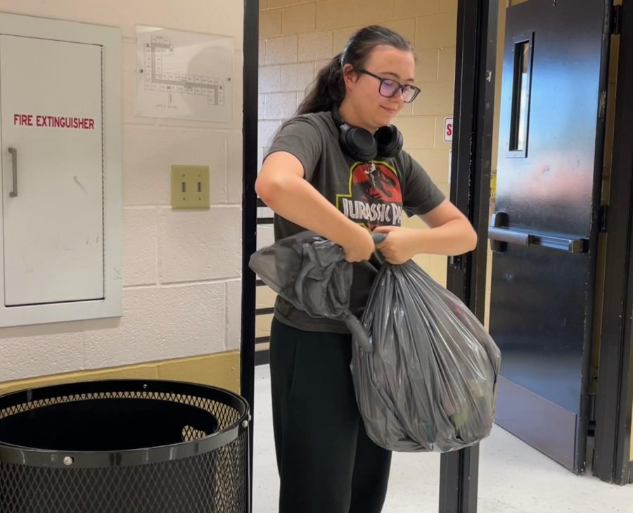 Brenna+Doss+cleans+the+FHN+school+building+on+Sept.+27.+Doss+is+a+senior+at+FHN+who+is+also+part+of+the+janitorial+team.+She+works+with+the+janitors+and+three+other+FHN+students+to+clean+the+building+doing+things+like+replacing+trash+bags+and+cleaning+bathrooms.+She+has+been+doing+it+for+around+six+months+and+initially+got+started+because+both+of+her+parents+work+in+the+district+and+the+help+was+needed.+