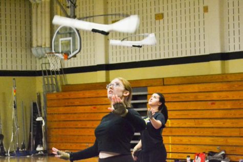 On November 16, the FHN winterguard practices together in the small gym. Captain Madelyn Clark leads drills with the other team members on rifle. This year’s show is titled Bound by Love. 
