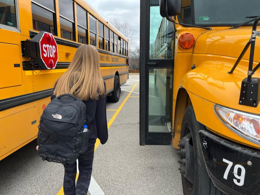 Rebecca Greishaber, a sophomore at North gets on the bus on Wednesday, Jan. 4. Greishaber is driven to school by a parent but takes the bus home. She will get her license when she turns sixteen later this year. 