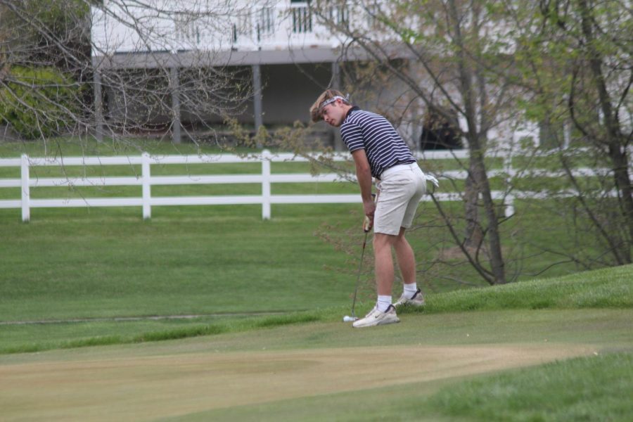 Senior Ian McDermott readies for a putt during a match on April 28, 2022. The Knights faced Fort Zumwalt North at the Links at Dardenne Golf course in which they won 167-183. McDermott finished the match with a score of 40.