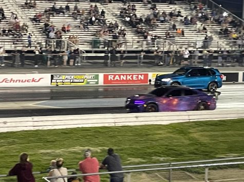 A BMW X5 and a Dodge Charger race for the fastest time on WorldWide Technology’s quarter mile drag strip. 