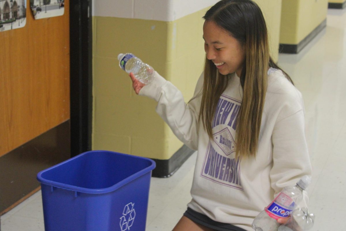 Senior+Hailey+Zhang+recycles+for+one+of+the+various+extracurricular+activities+that+she+is+involved+in.+