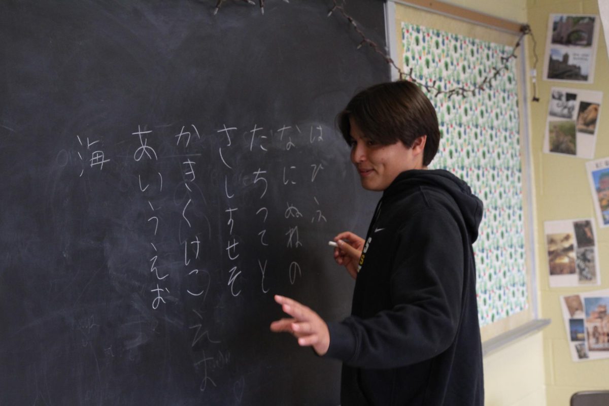 Kai Gustafson teaches his Japanese class at Webster University to children. 