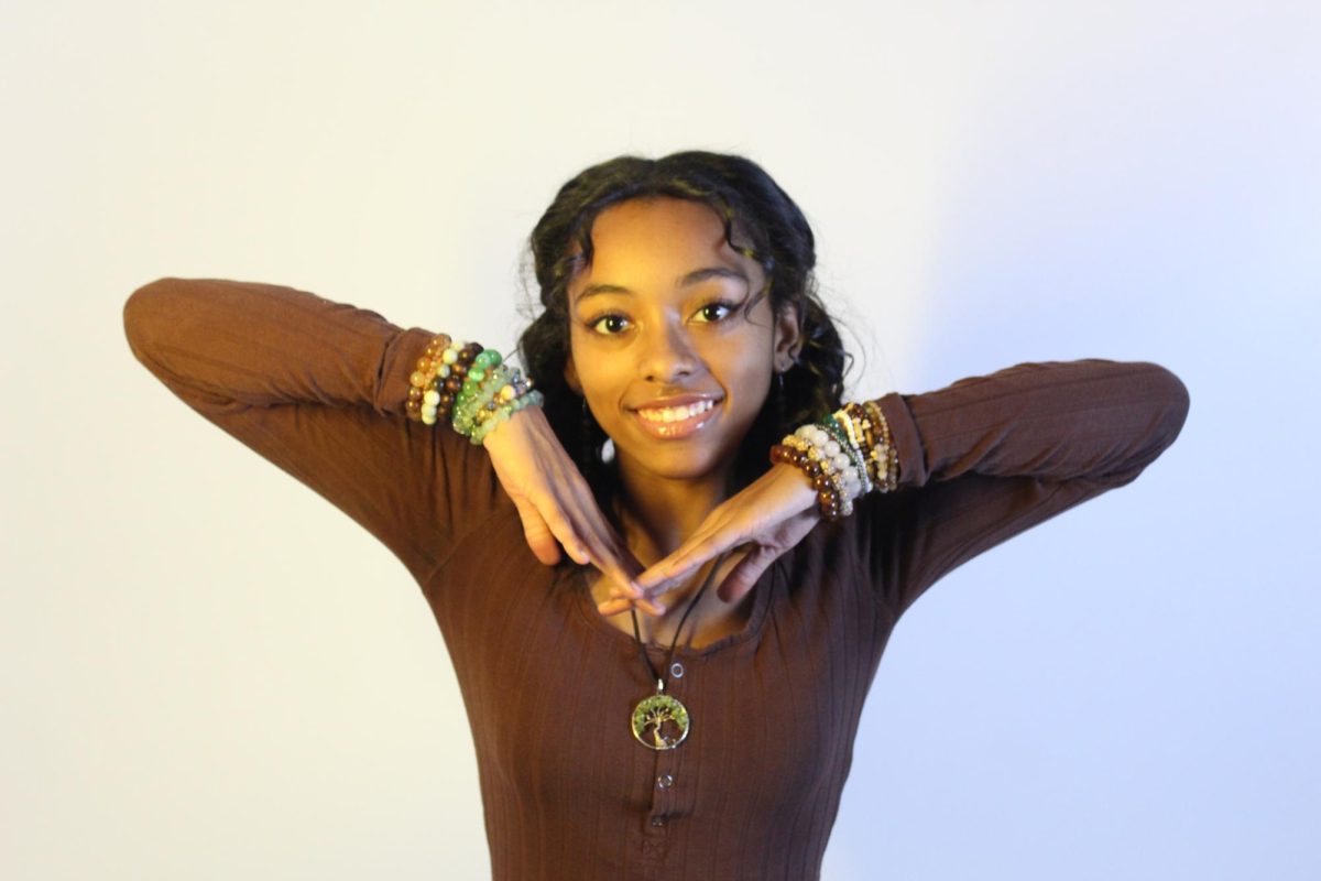 Sydney Staten poses for a picture. Staten is known for making various types of jewelry. 