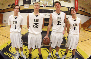 the four seniors from this year's basketball team stand on their home court (photo by Amanda Eckhard)