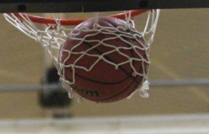 A ball swishes through the net during a shootaround file photo)
