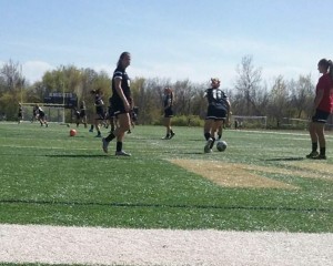 The varsity girl's soccer team practices for their game against FHHS