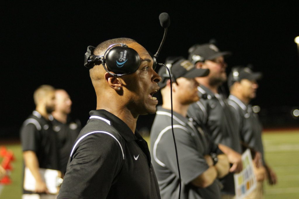 FHN coach Arty Johnson yells to his team from the sideline (Chase Meyer)