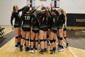 Varsity volleyball team prepares to start their third game during their home match against Fort Zumwalt West on 9/20. The team ended up loosing a hard fought game with the final game ending with a score of 23-25. (Photo by Heidi Hauptman)