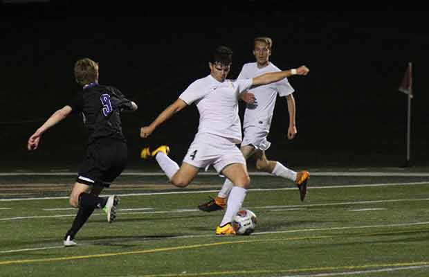 Senior Ozzy Guerrero clears the ball in the midst of FZW's Bryan Prichard (Adam Quigley)