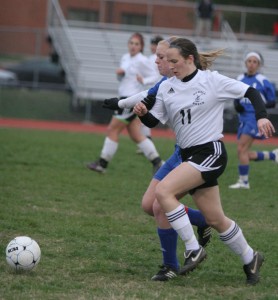 Kelsey Fouch fights an opponent for the ball in a game against Duchesne. 