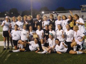 The Varsity girls Soccer team poses with their District Championship plaque that they received when they won their District on Friday May 20. The girls defeated the Howell Vikings 2-1 in the second overtime to capture the title.