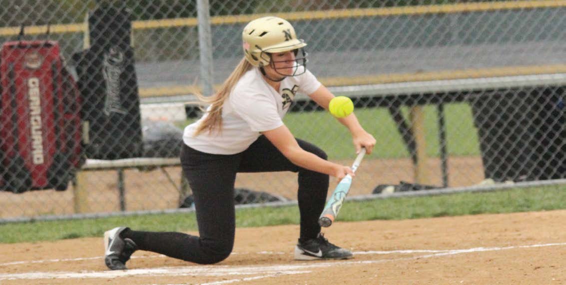 Junior Jessica Grimes, bunts the ball in a game against Hazelwood Central on Oct. 1. The Knights
pulled a 9 to 4 victory during the Varsity team’s Senior Night. (zack eaton)