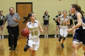 Lady Knight number 10 dribles down the court in an effort to create an opportunity to score.