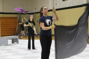 Juniors Maddie Corrao and Sydney Hardin practice with FHN’s Winter guard on Feb. 7. This year, the guard is competing in the Open division which is the highest competition level. The team has taken first place in its division at both of the competitions so far. The team’s performance for this year’s show is called, “The Spirits Within.” (photo by sammie savala)