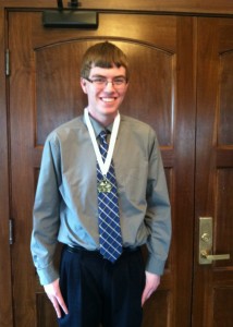 Senior Nathan Rhomberg wearing his medal after the ceremony and lunch. (Photo by Chelsie Hollis)