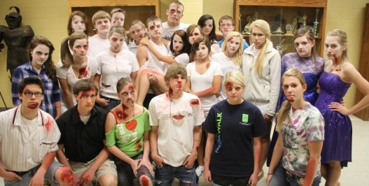 Students participating in last year's simulation gather around before showcasing the effect of drunk-driving accidents that occur in a single school day. (File Photo)