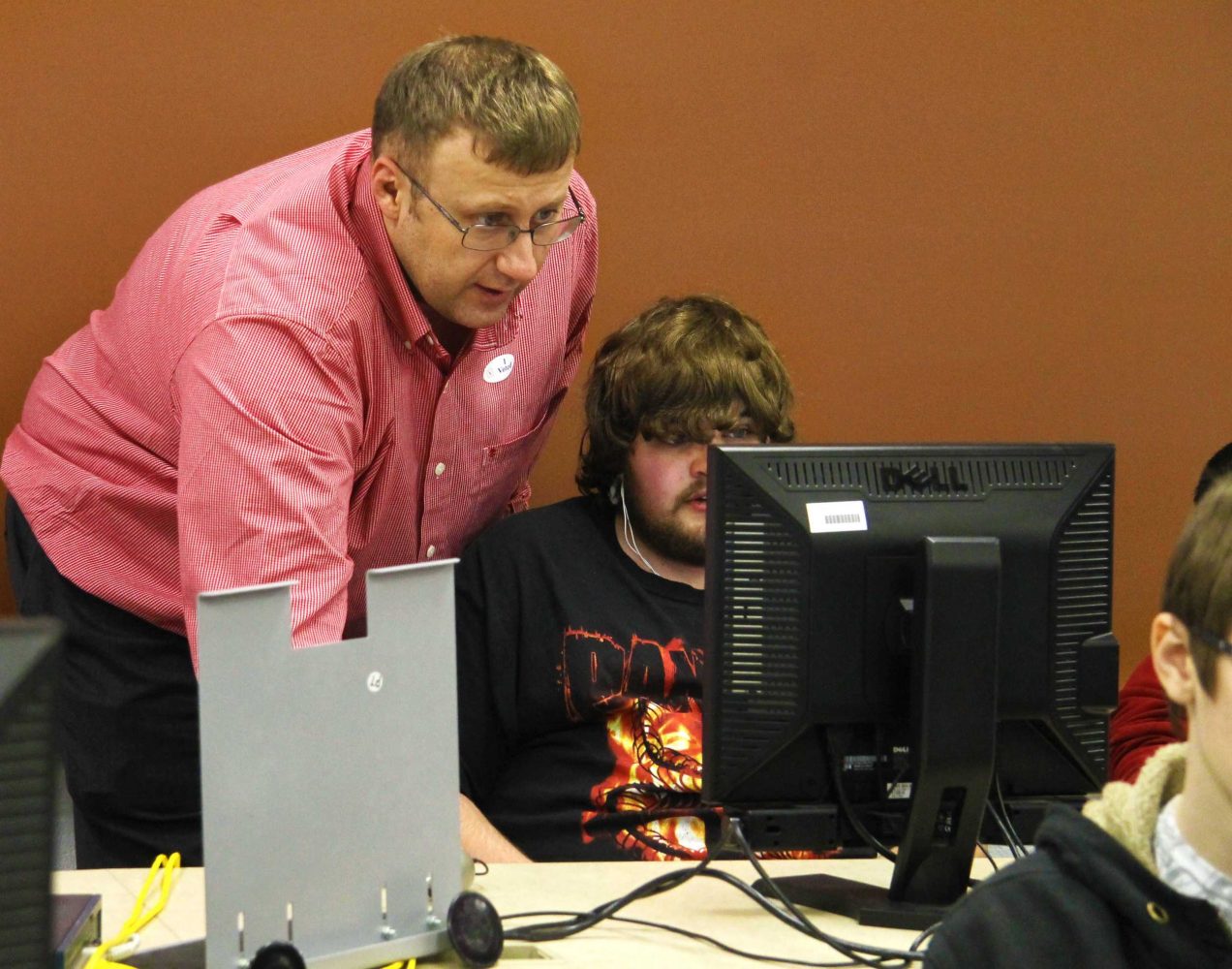 Spencer helping students vote at student election day 