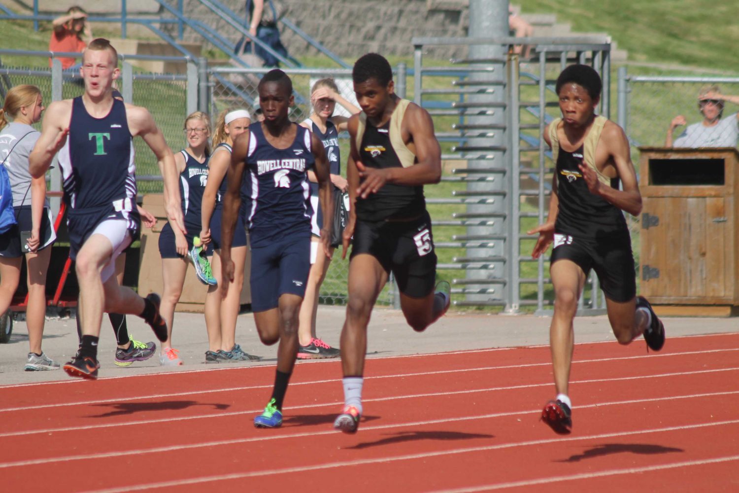 Runners finish 100m dash