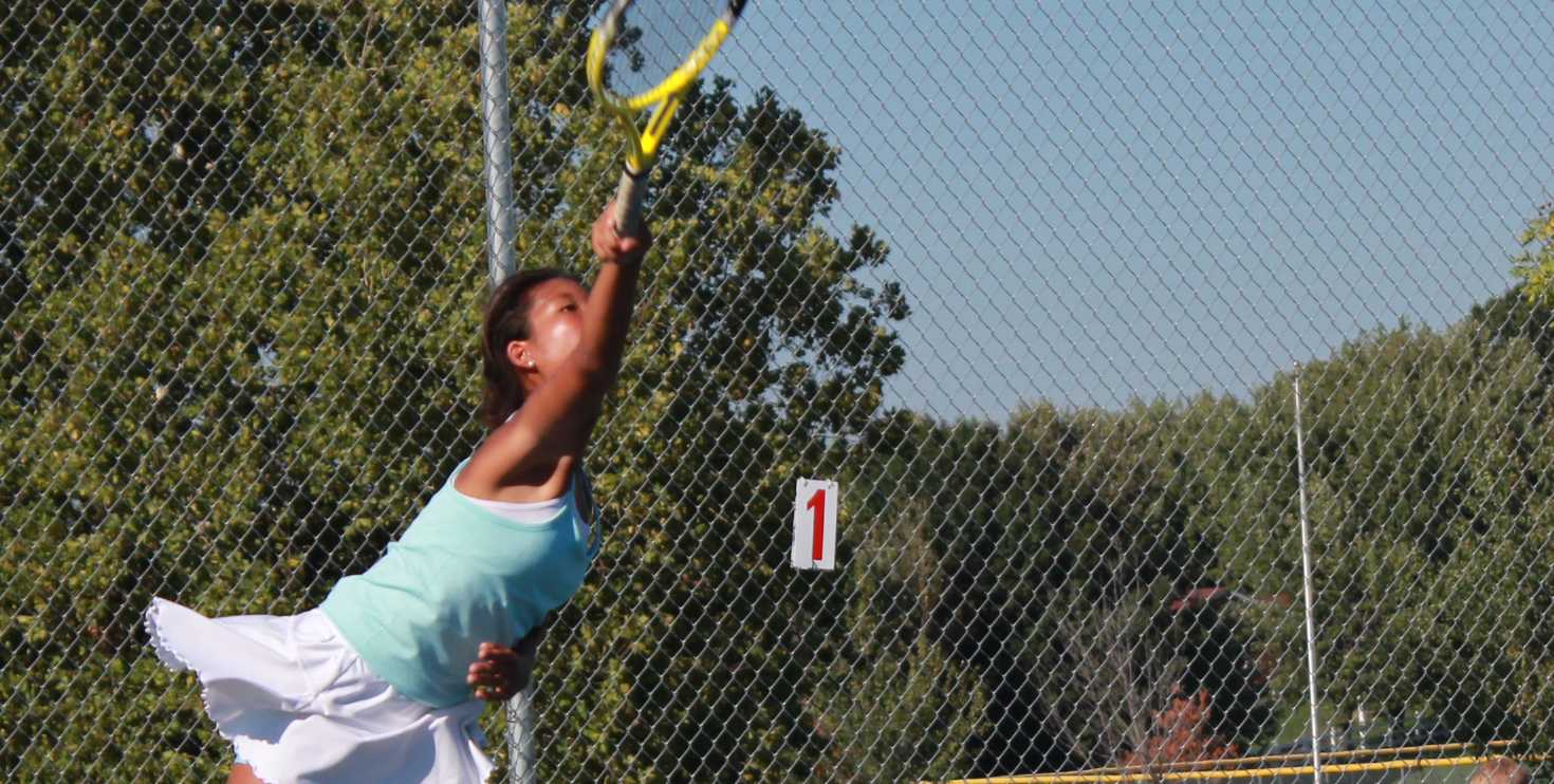 Junior Risa Takenaka serves 