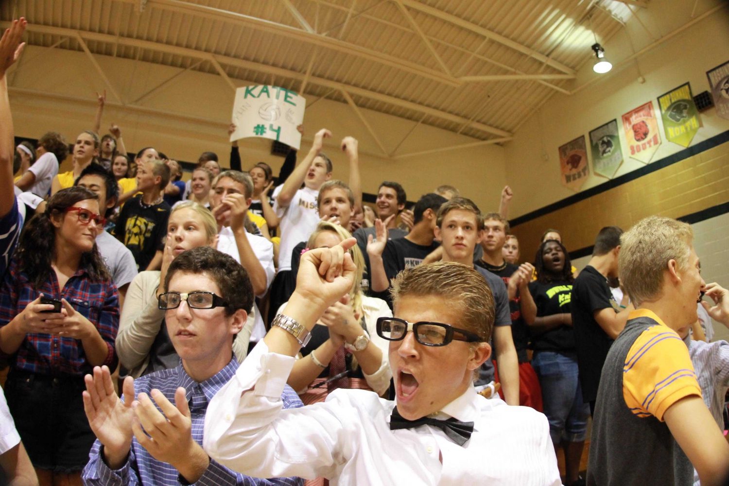 Brandon cheers on the girls varsity volleyball team. (ariel kirkpatrick)