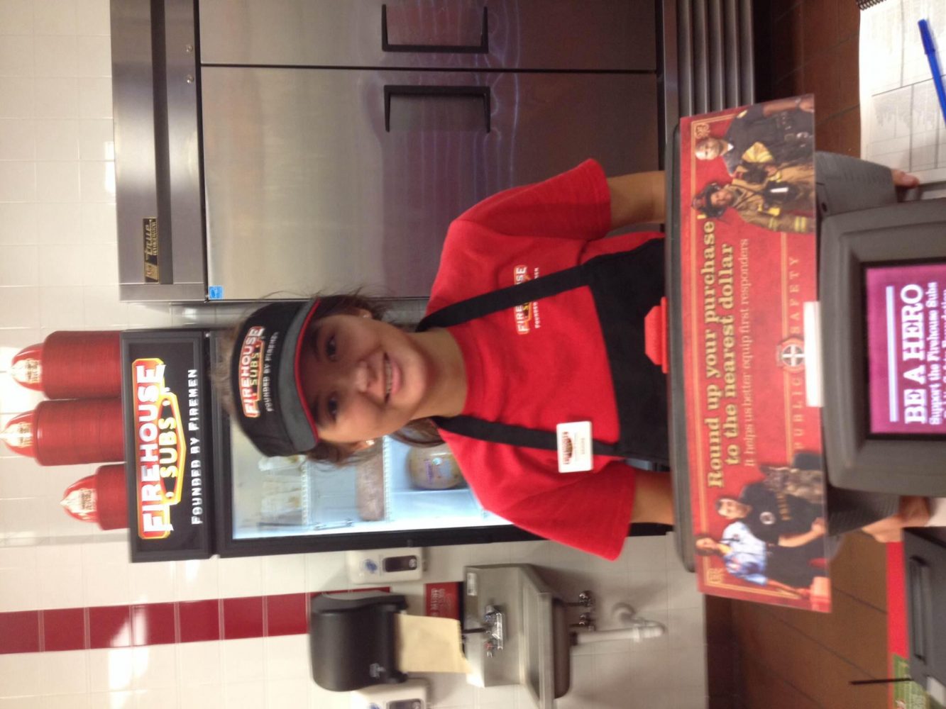 Junior, Brooke Horner, starts her day off by taking orders as customers arrive at Fire House Subs. 