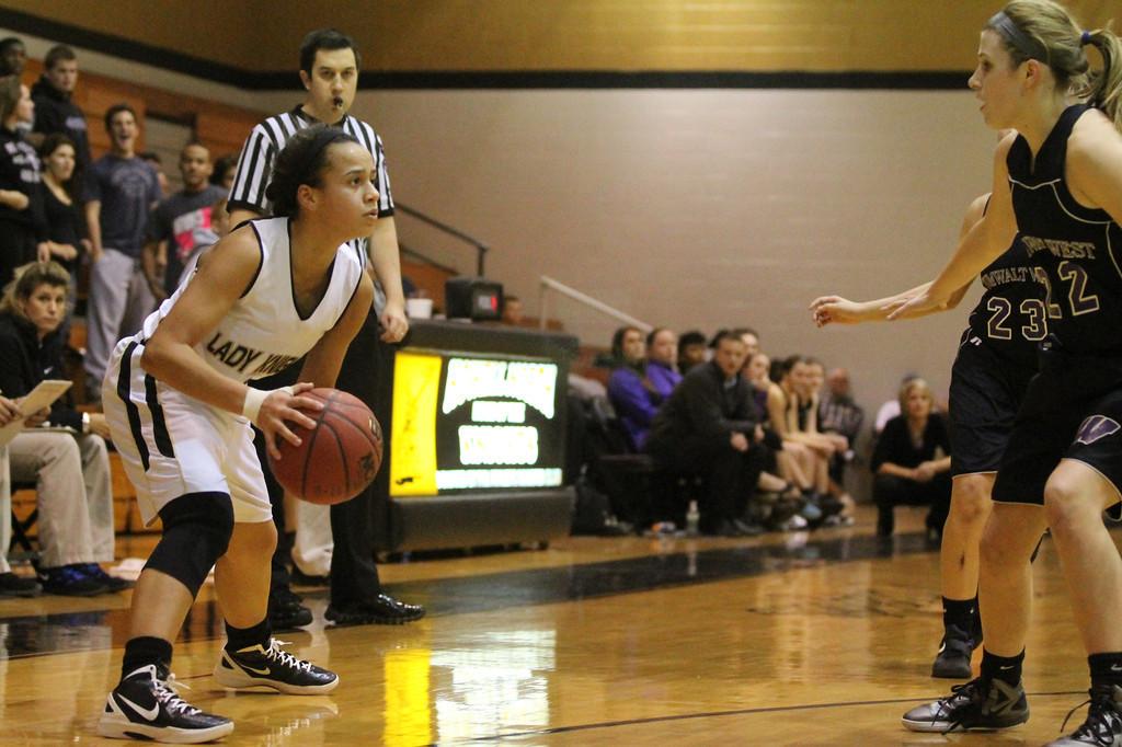 Paige Pauly looks for an open pass to a teammate against the opposing team.