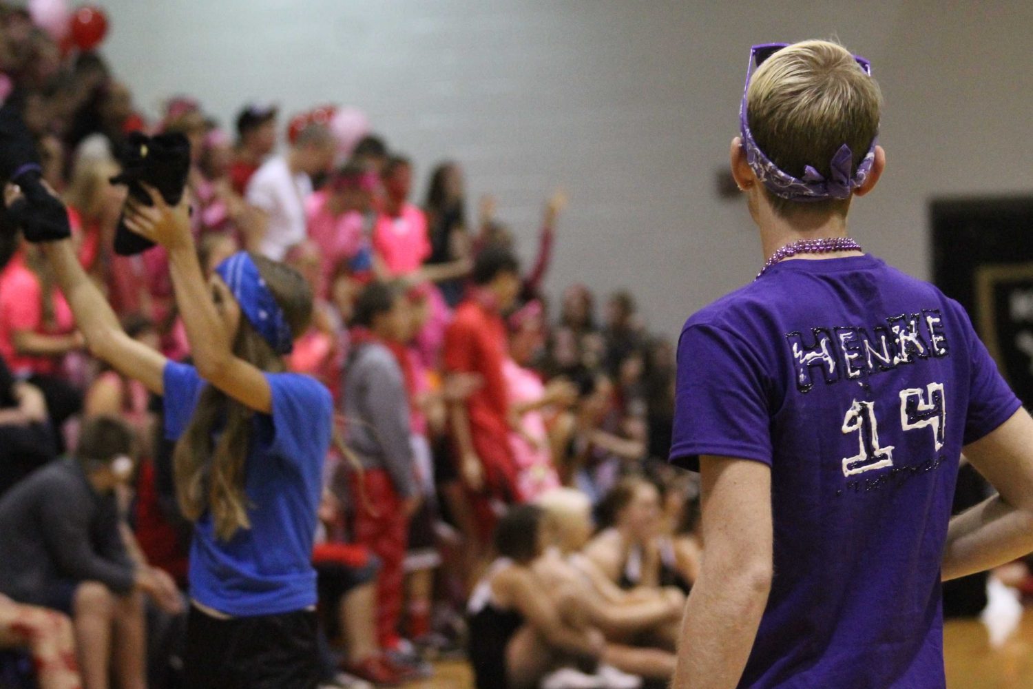 Senior Joe Henke, emcee, watches the crowd.