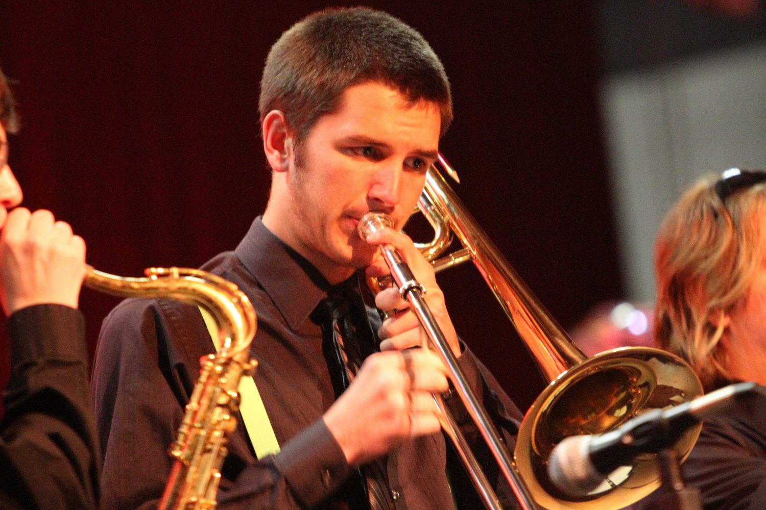 Alum Mike Lindsey performs his trombone during the winter concert. Lindsey was one of seven students to make All State Band.