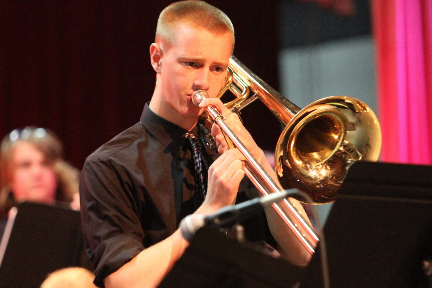 Band student plays his trombone on stage during a previous winter concert. 