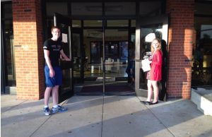 Communications Officer Elise Gertsch greets students on Friendly Friday. (photo by sammie savala)