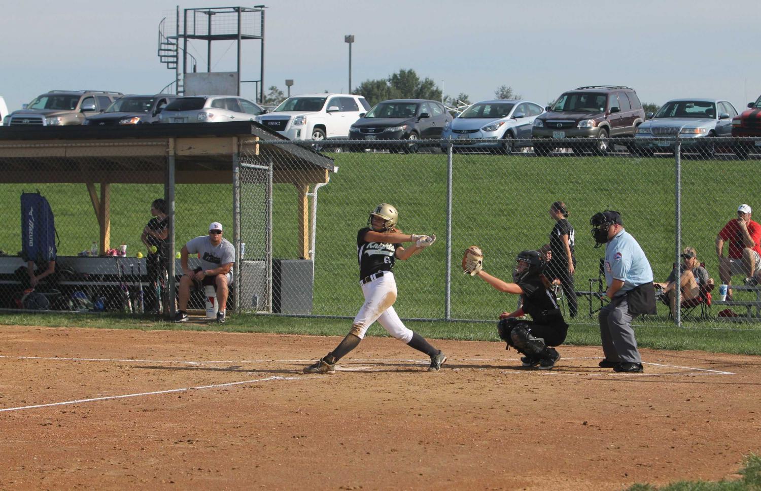 Number 6 swings the bat getting a double.